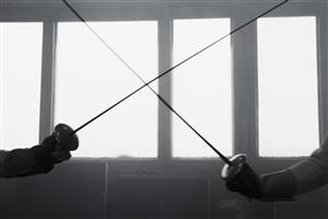 Fencers cross foils